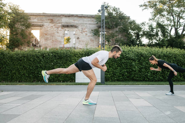 istock Couple working out together outdoors 1404833703