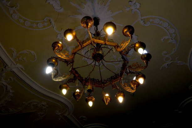 istock A beautiful old metal chandelier hangs from the ceiling. 1404835023