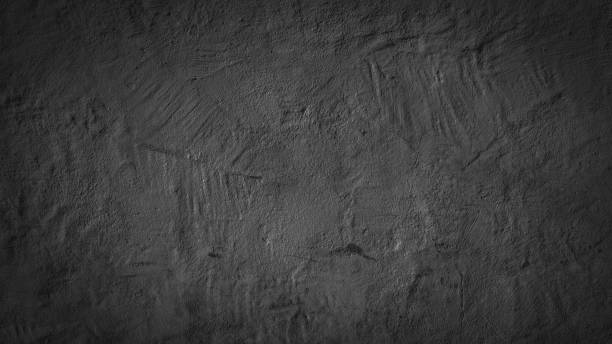 istock Abstract black anthracite gray grey old aged retro vintage painted paper concrete cement facade plaster wall texture background 1404836010