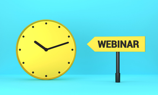 Yellow clock and Webinar signpost on blue background. Reminder Concept.