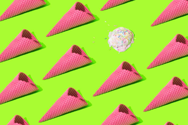 istock Neon pink ice cream cone pattern on a neon green background 1404839642