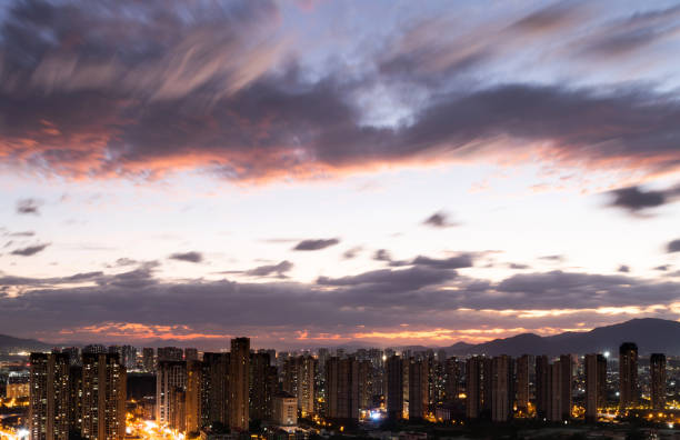 City buildings and sunset sky.