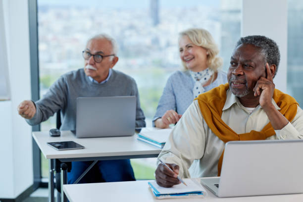 istock A multicultural senior student is following lecture in a classroom with his classmates. 1404841728