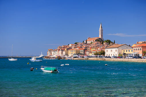 Distant view from the shore on the town of Rovinj with Church of St. Euphemia tower