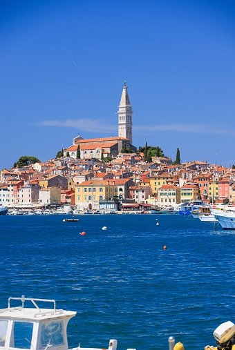 View across the blue sea on the town of Rovinj with Church of St. Euphemia tower