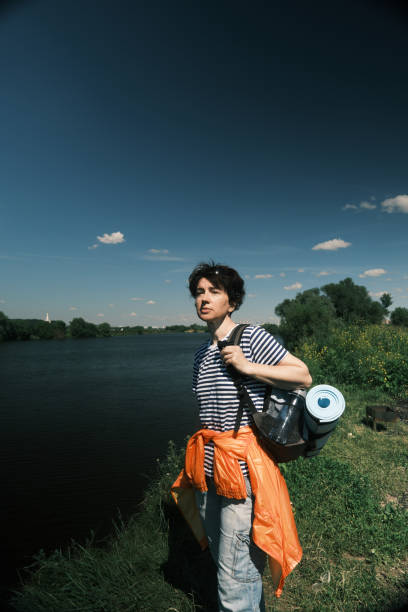 istock Middle-aged woman is passing time in hiking 1404844117