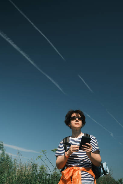 Middle-aged woman is passing time in hiking