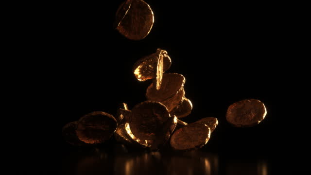 Golden and shiny Ancient Roman Coins falling on black background