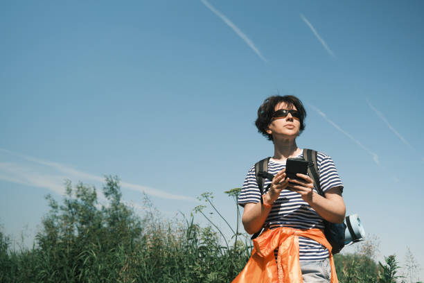 istock Middle-aged woman is passing time in hiking 1404844168