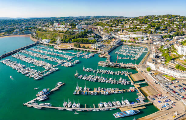 istock Boats in Torquay Harbour and Torbay Coastline 1404845358