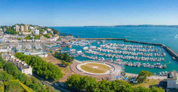 istock Boats in Torquay Harbour and Torbay Coastline 1404845546