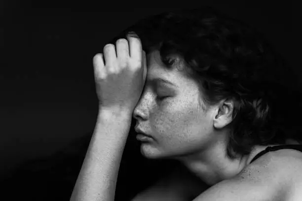 Photo of Black and white portrait of a beautiful woman with freckles