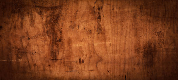 istock old brown rustic weathered scratched dirty dark wooden table wall texture - wood timber background panorama banner 1404846610