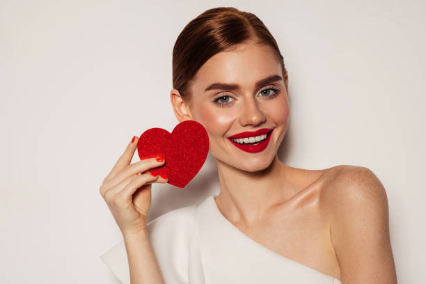 istock Beautiful emotional woman holding present box 1404846712