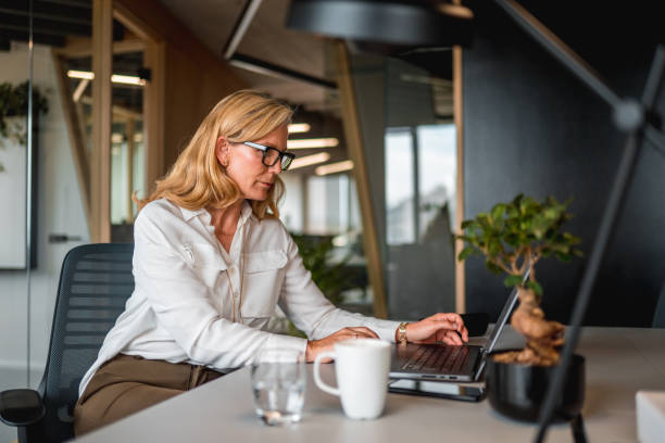 istock Mature Caucasian Female Business Developer Working In A Modern Office 1404848729