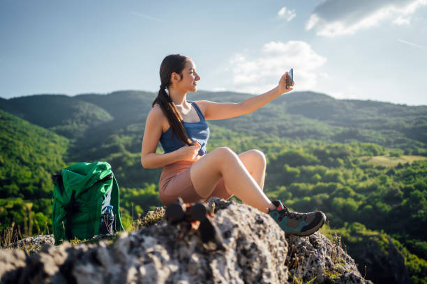 istock Hiker woman taking selfie in nature 1404849663