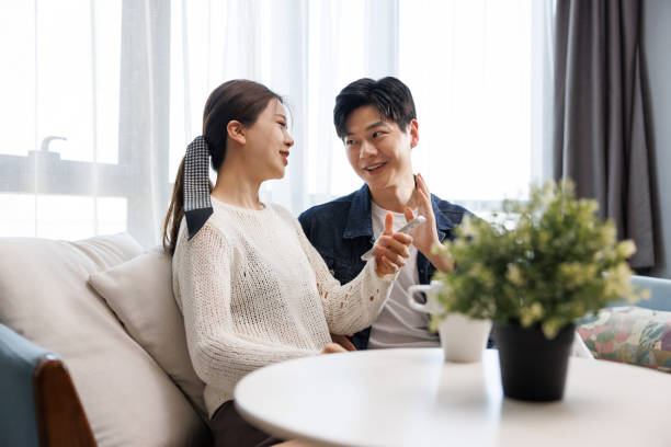 istock Young Asian couples talk happily at home 1404849681