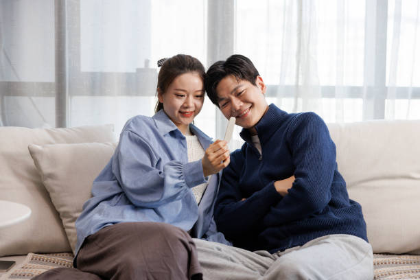 istock Asian couple feeling happy when see the pregnancy test result from testing kid. 1404849698