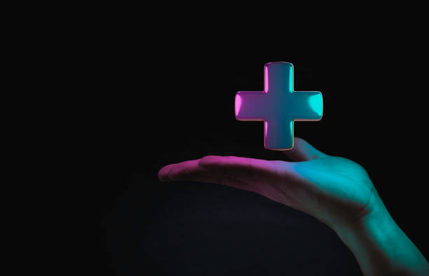 istock Hand hold ing Plus sign on dark technology background for positive thinking mindset of personal development benefit and health insurance concept. 1404851504