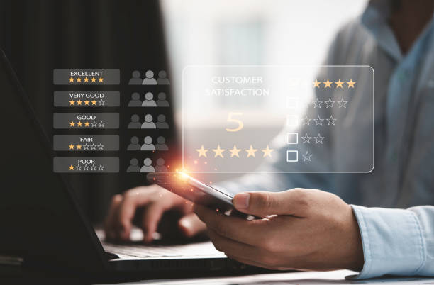 istock Customer satisfaction survey concept, Businessman using computer laptop and smartphone to select excellent yellow five stars to evaluate product and service. 1404851598