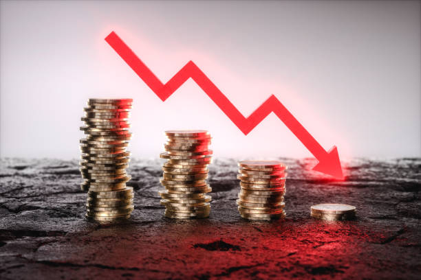 istock 3D Illustration. Coins stacks with a falling red arrow. 1404851766