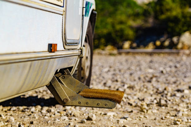 Doormat on metal steps of camper car recreation vehicle. Travel in motorhome, holidays.