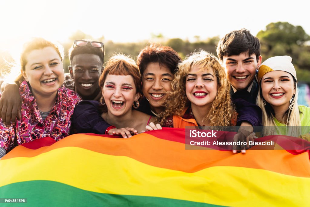 Diverse young friends celebrating gay pride festival - LGBTQ community concept LGBTQIA People Stock Photo
