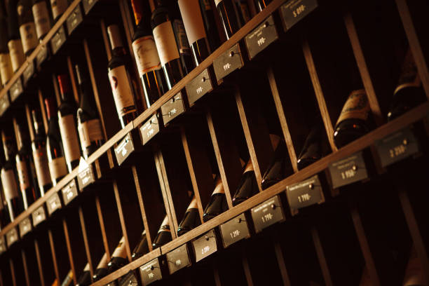 istock Wine cellar with elite drinks on shelves with written names 1404854656