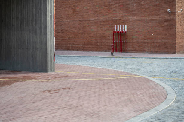 istock Fire fighting facilities beside the red brick wall 1404854705