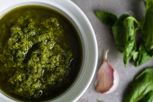 istock Pesto sauce. Basil pesto. Close-up 1404855978