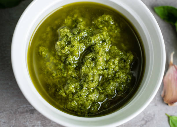 istock Pesto sauce. Basil pesto. Close-up 1404856011