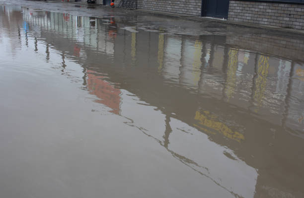 istock dirty puddles on the road reflection in autumn depression 1404856143