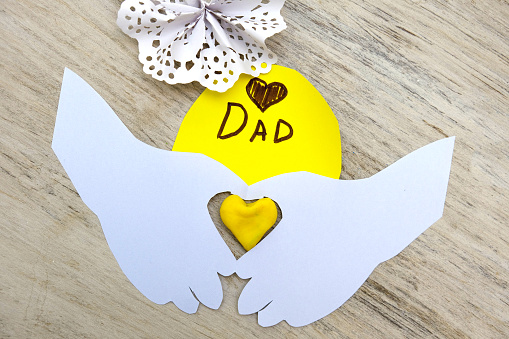 Preparing for Fathers day, Birthday or Valentines day . Child making funny crafts, greeting card from paper and clay, plasticine.  Arts  crafts concept.