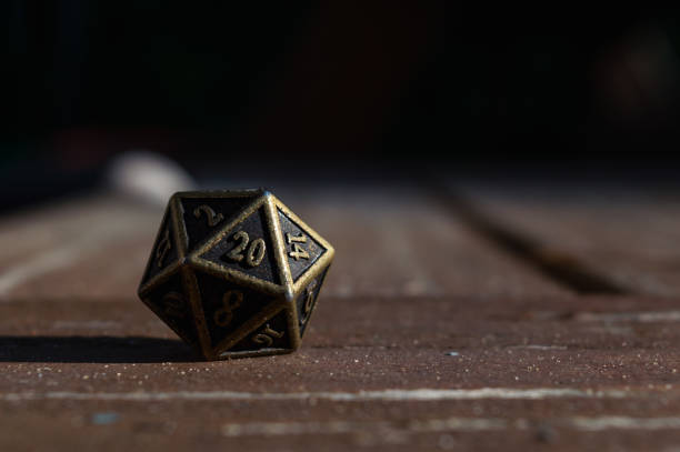 istock Close-up image of a metallic d20 in the sun 1404859397