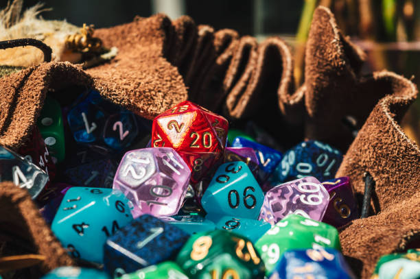 A bunch of rpg dice in a dice bag stock photo