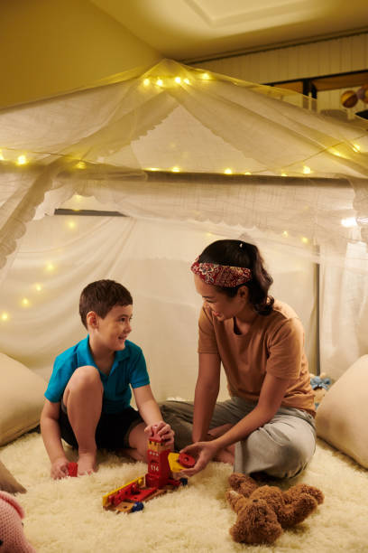 istock Mother and Kid Playing Together 1404860533