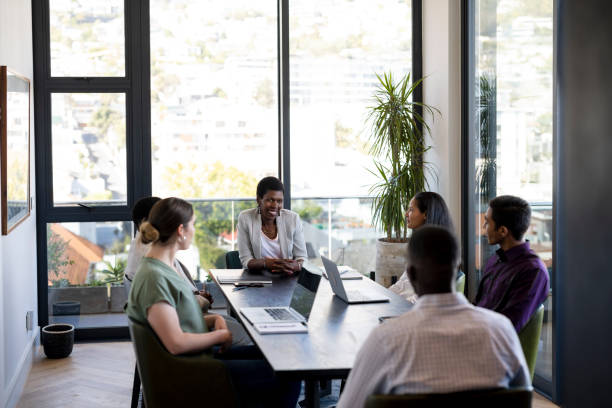 istock Wide shot multiracial corporate team in boardroom 1404860957