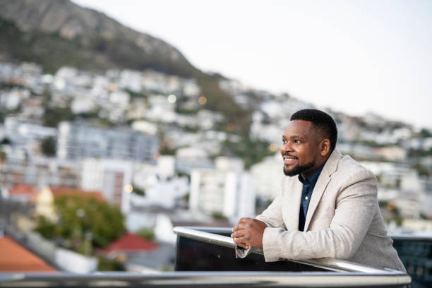 istock Businessman looking out over city views 1404861347