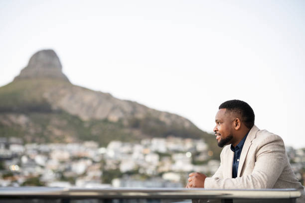 istock Side view businessman looking out at city view from balcony 1404861467