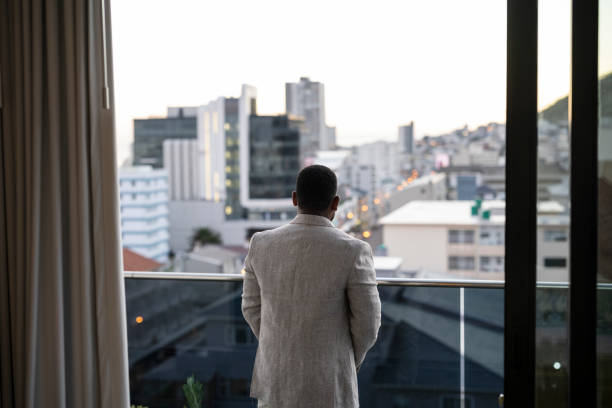 istock Back view businessman looking over city 1404861564