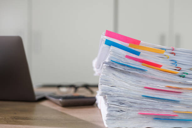 istock Stack of business paper Businessman working reading documents graph financial to job succes Analyze document plans documents on office desk 1404863593