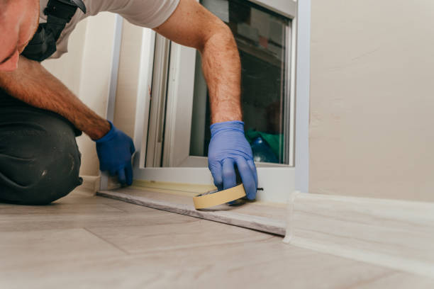istock Young man applying mounting tape before sealing 1404866834
