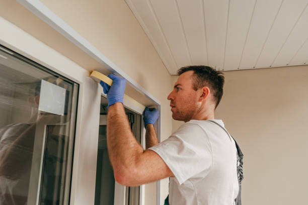istock Young man applying mounting tape before sealing 1404866879