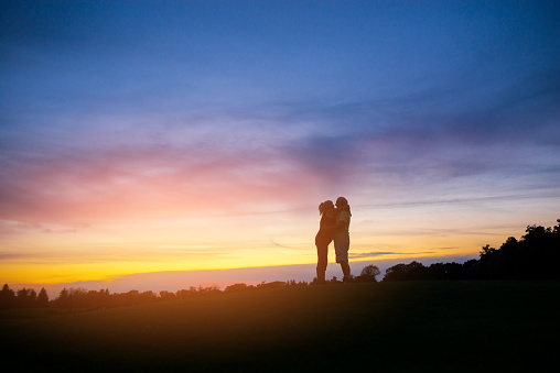 Couple on sky background. Two people standing and hugging. Feel the tenderness. My heart is yours.
