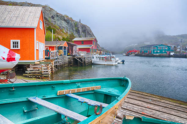 Charming fishing village of Quidi Vidi in St John's, Newfoundland, Canada St John's, Newfoundland, CA - June 16, 2019: Historic old  fishing village of Quidi Vidi in St John's, Newfoundland, Canada newfoundland island photos stock pictures, royalty-free photos & images
