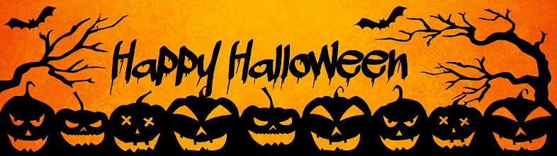 HALLOWEEN background banner wide panoramic panorama template -Silhouette of scary carved luminous cartoon pumpkins isolated on dark orange night texture