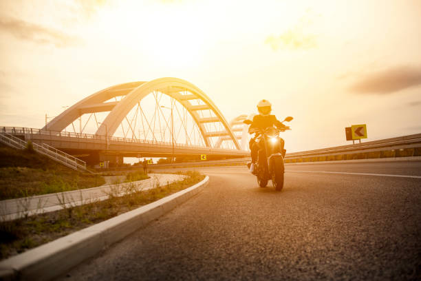 istock Motorcyclist in the sunset 1404873418
