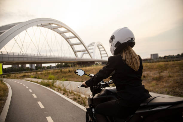 istock Young woman riding a motorcycle 1404873508