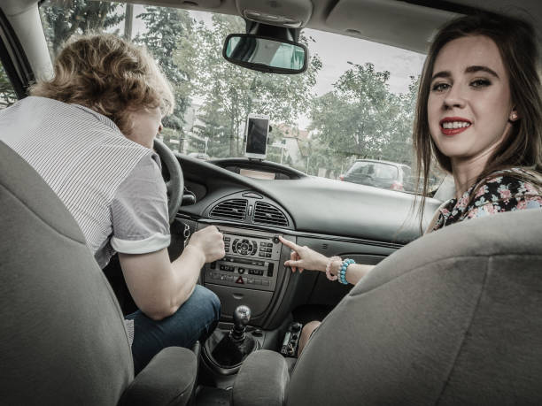 istock Couple in car setting air conditioning 1404873611