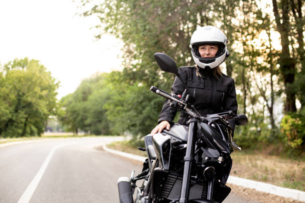 istock Young woman riding a motorcycle 1404874308